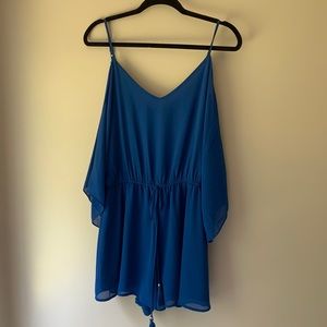 Blue dressy romper brand is Naked Zebra great condition size large